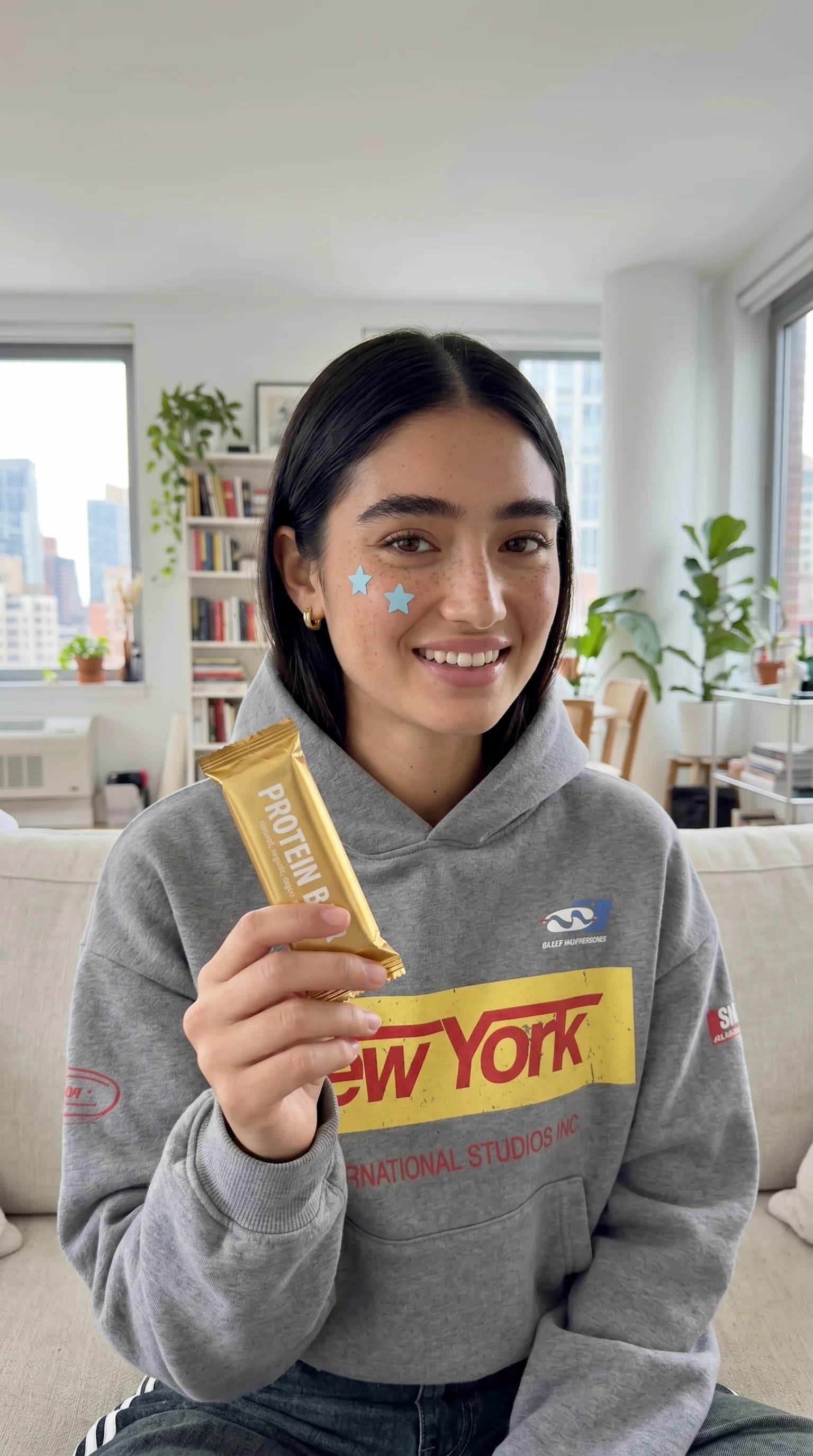 Portrait at home with a protein bar